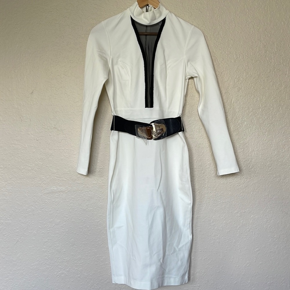 New dress with tags! Beautiful White dress with belt.